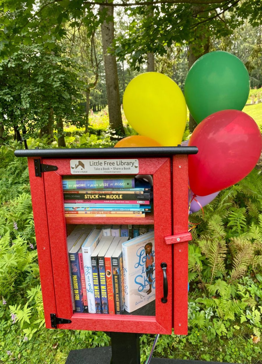 In the Yaddo Gardens, the artists colony unveiled its free lending library for kids and young adult readers on Aug. 9, 2023.  Photo by Thomas Dimopoulos. 