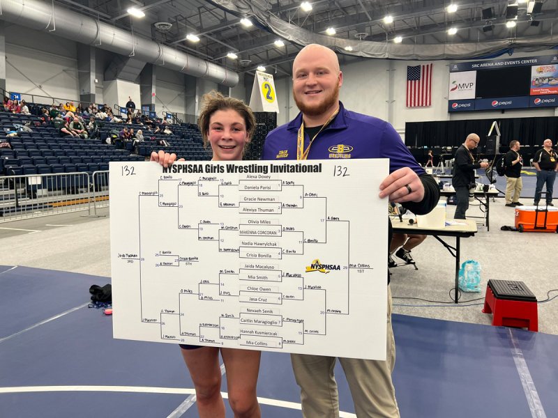 Ballston Spa’s Mia Collins poses with the final bracket of the NYSPHSAA Girls’ Wrestling Invitational. Photo via @NYSPHSAA X/Twitter account.