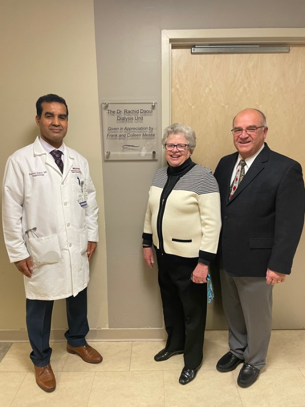 Dr. Rachid Daoui poses with Frank and Colleen Messa outside Saratoga Hospital’s new dialysis unit named in his honor. Photo provided by Darlene Olivieri Alvarado.