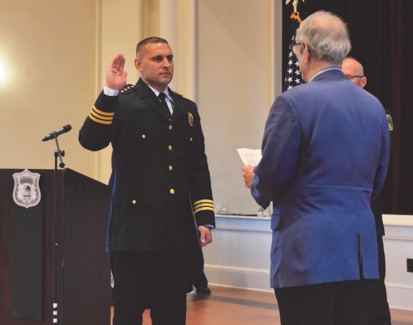 Tyler McIntosh taking the oath of office as Saratoga Springs Chief of Police on June 27, 2023 at Saratoga Music Hall.  Photo: Super Source Media Studios.