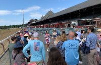 Samantha Bosshart, executive director of the Saratoga Springs Preservation Foundation, leads a tour of the Saratoga Race Course on Friday, June 7 during the Belmont Stakes Racing Festival. Photo by Jonathon Norcross.