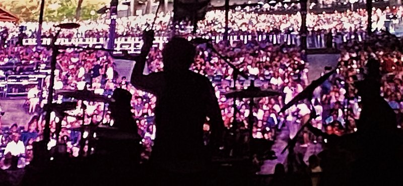 Live shot of a screen shot from behind drummer Daxx Nielsen leading Cheap Trick in their show opener of  “Dream Police” at Saratoga Performing Arts Center July 22, 2022.  