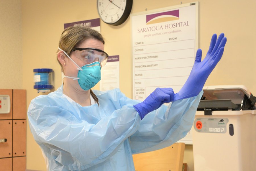 Chrissy Citarella, BSN, RN, CMSRN, dons personal protective equipment (PPE) at Saratoga Hospital. Photo provided.