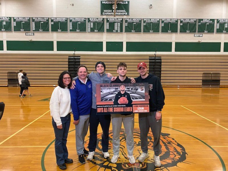 Schuylerville High School basketball player Luke Sherman poses on the court at Hudson Falls in January after breaking his school’s all-time boys scoring record. Photo provided by Taryn Kane.