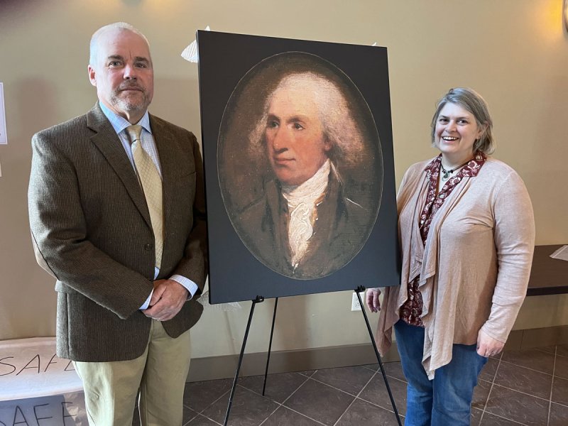 Ian Murray receiving a donation of General Schuyler’s portrait from  Deb Peck Kelleher. Photo provided.