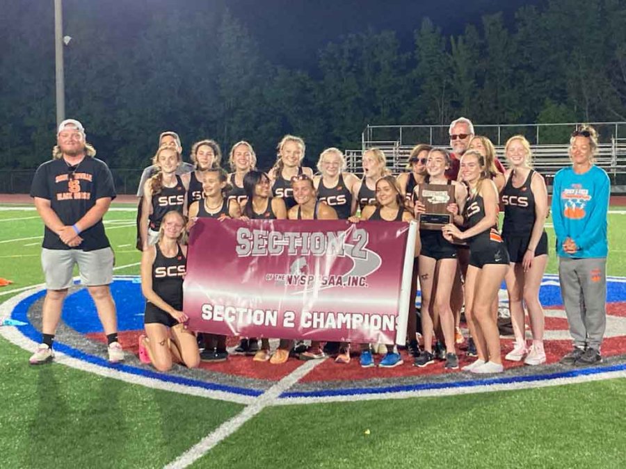 The Schuylerville varsity girls track and field team celebrates its third-straight sectional title at Broadalbin-Perth High School last week. Photo by John Schmitz.