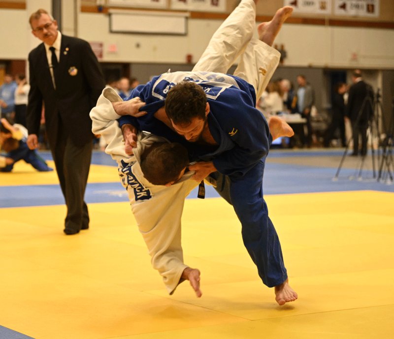 Kell Berliner (blue) throws an opponent. Berliner placed seventh at the Perth International Open in Perth, Australia, on Oct. 30. Photo provided by Jason Morris.
