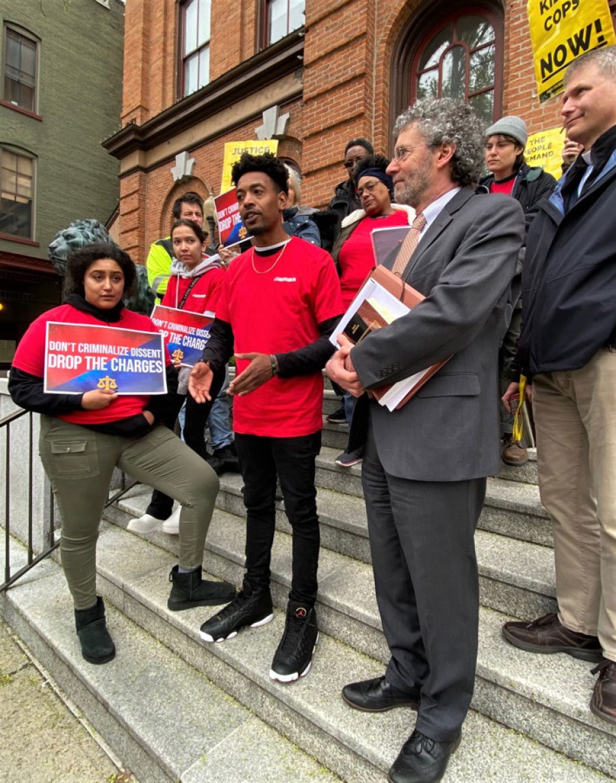 Saratoga Black Lives member Lexis Figuereo on the steps of City Hall shortly after his court appearance on April 24, 2023. To Figuereo’s left is his attorney Mark Mishler. Photo by Thomas Dimopoulos.  