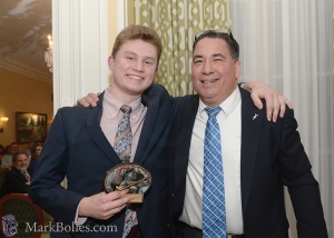 Coach Dave Torres celebrates with senior Elliott Hungerford, who received the Most Valuable Player and 2016 Hobie Baker Character Awards. Hungerford was also the CDHSHL Player of the Year. 