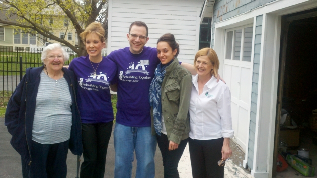 Linda Kahn stands with volunteers of Rebuilding Together Saratoga in 2013 in front of her garage that was repainted.