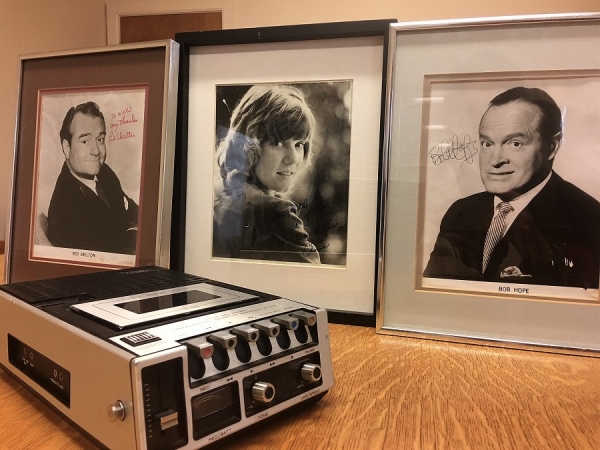 Memorabilia from the Saratoga Fair, and an old-school tape recorder, such as was used in the 1970s for recording interviews.      