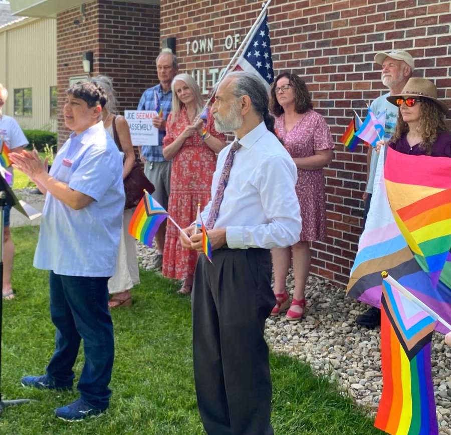 Minita Sanghvi (blue shirt) and Joe Seeman (wearing tie) joined by supporters at Milton Town Hall on June 17, 2024 to call upon the Milton Town Board to reverse their ban on flags on public property and to raise the Pride flag at Town Hall. Photo by Thomas Dimopoulos