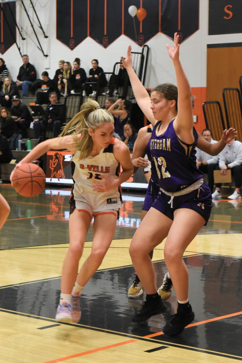 Schuylerville’s Macey Koval (12) looks to drive to the hoop during the Black Horses’ 57-52 win over Amsterdam on Feb. 1. Photo by Super Source Media Studios.