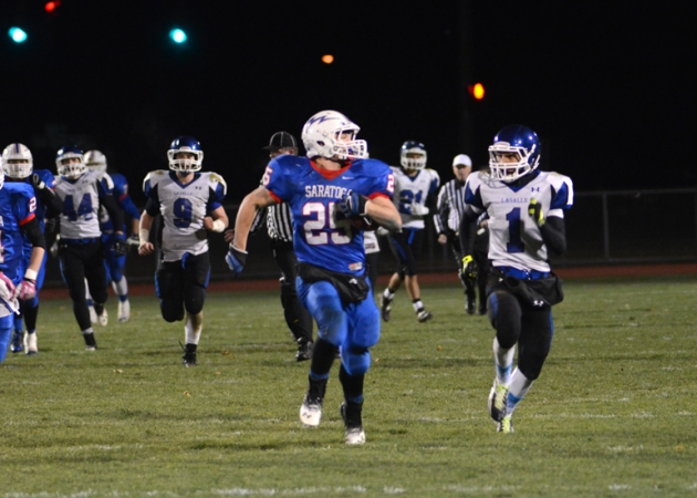 Sophomore running back Dakota Harvey finds open space in the Blue Streaks 48-27 win over La Salle. Harvey rushed for 165 yards, as Saratoga Springs won its first game since 2009 in front of the home crowd. Photo by MarkBolles.com