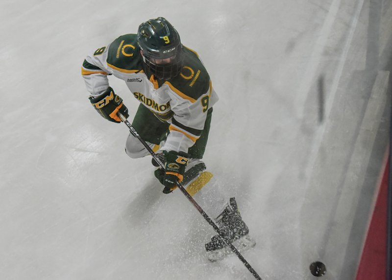 Skidmore’s Kevin Urquhart (#9) handles the puck during a game last season. Photo by Super Source Media Studios.