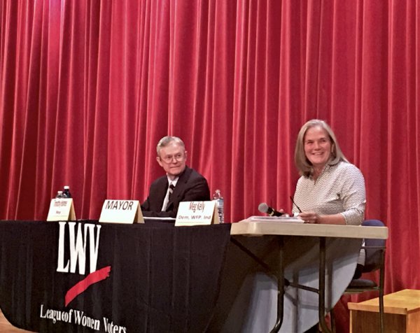 Republican mayoral candidate Tim Holmes and incumbent Democrat mayor Meg Kelly on the second of two Meet The Candidates nights, Oct. 22, 2019, sponsored by the League of Women Voters of Saratoga County, and staged at the Saratoga Springs High School auditorium. Photo by Thomas Dimopoulos.