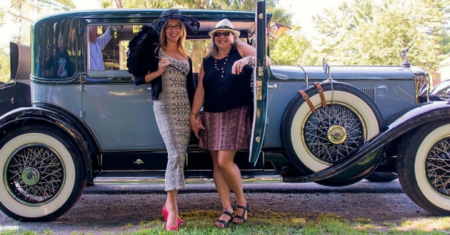 Robin Barker and Cynthia Kazmirsky in front of a 1929 Cadillac Model 341 