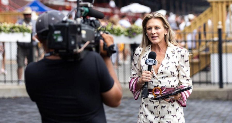 Fox Sports racing analyst Maggie Wolfendale reports live from a paddock. Photo via Pottheiser Photo/New York Racing Association.