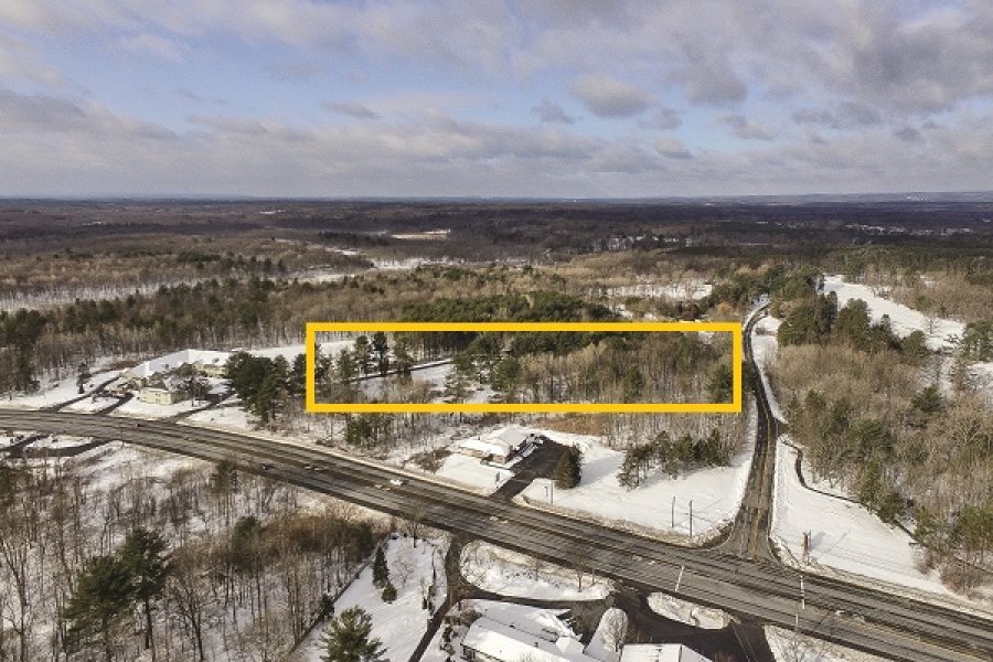 - Facing west above Route 9, which runs left (south) to right (north). For orientation purposes, note SPAC sits just out of view, at the right. The proposed project would be developed upon the lands between Columbia Avenue and East West Road - shown here feeding off Route 9 and heading west.