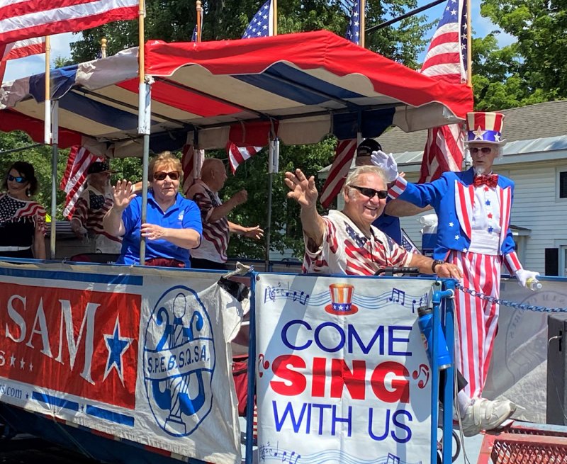 The Uncle Sam Chorus rolls down Broad Street during the Schuylerville Turning Point Parade on Aug. 7, 2022. Photo by Thomas Dimopoulos.