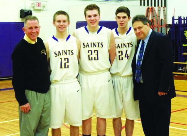 Coach Mike Beson (far left) with members of the Saratoga Central Catholic basketball team and head coach Ken Mantia at last season&#039;s senior night. Photo Provided.