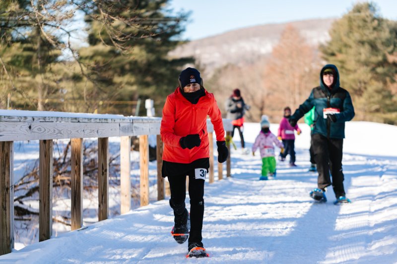 Snowshoers participate in a  race at the first Winterfest at Brookhaven Winter Park.  Photo by Erin Fortin Photography.