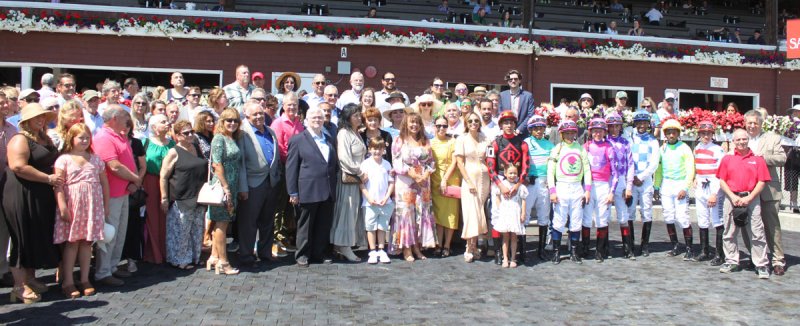 Members of the racing community gather in the Winner&#039;s Circle last Sunday in honor of Ramon &quot;Mike&quot; Hernandez. Photo by Tony Podlaski