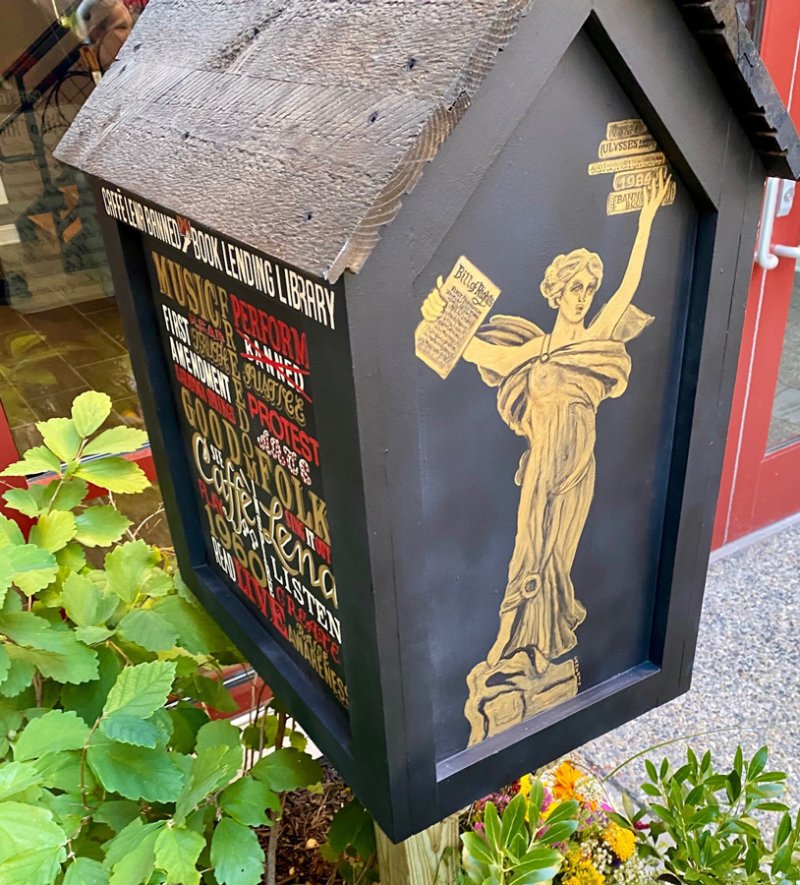 The Banned Book Lending Library, installed at Caffe Lena on Aug. 24, 2022, on a night that featured stage readings excerpted from some of the volumes. Photo by Thomas Dimopoulos. 