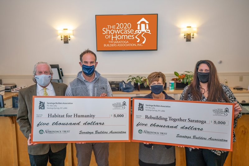 The Saratoga Builders Association is grateful and proud to present $10,000  to our local charities from this year’s 2020 Saratoga Showcase of Homes TV event.  From left to right: Barry Potoker, Executive Director &amp; Showcase Co-Chair – Saratoga Builders Association; Adam Feldman, Executive Director – Habitat for Humanity of Northern Saratoga, Warren &amp; Washington Counties; Michelle Larkin, Executive Director - Rebuilding Together Saratoga County; Lisa Licata, Director of Sales &amp; Marketing &amp; Showcase Co-Chair - Sterling Homes. Photo provided.