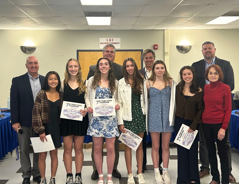 The Saratoga Springs City School District Board of Education celebrates the championship girls and boys’ cross-country teams at a meeting on January 11. Photos via the SSCSD Twitter/X account.