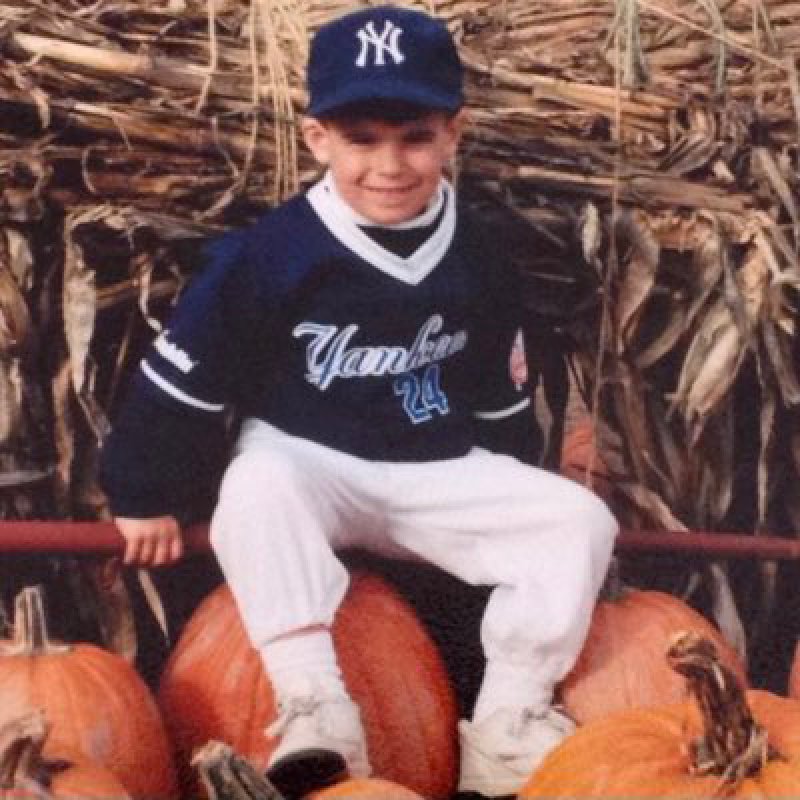 Childhood photo of infielder Kevin Smith dressed in a New York Yankees uniform via Smith’s @KJS_4 X account.