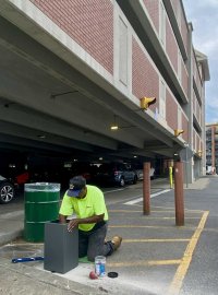 Work underway on pay station on Monday, June 17, 2024 at the Woodlawn Parking Garage regarding Saratoga Springs’ new paid parking scheme. Photo by Thomas Dimopoulos.