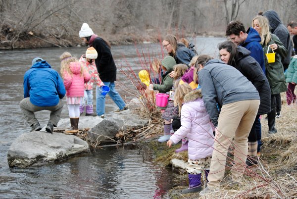 Saratoga Independent School students release rainbow trout into the Kayaderosseras Creek on Friday. Photo by Dylan McGlynn.