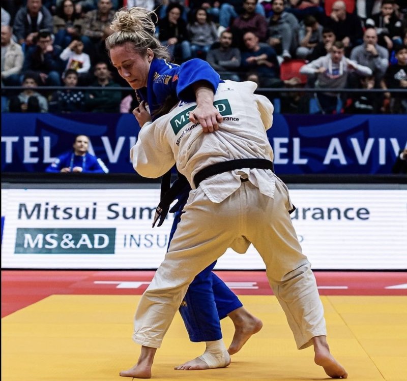 Photo: JMJC’S Hannah Martin (blue uniform) gripping opponent in Tel Aviv. Photo provided.