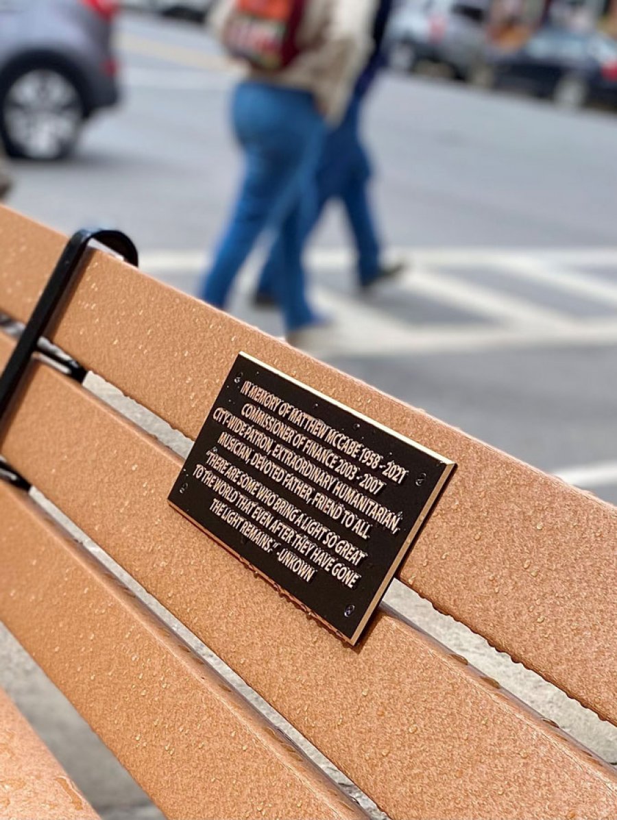 Plaque fixed to a bench honoring the late Matt McCabe was placed on Broadway this week. Photo by Thomas Dimopoulos. 