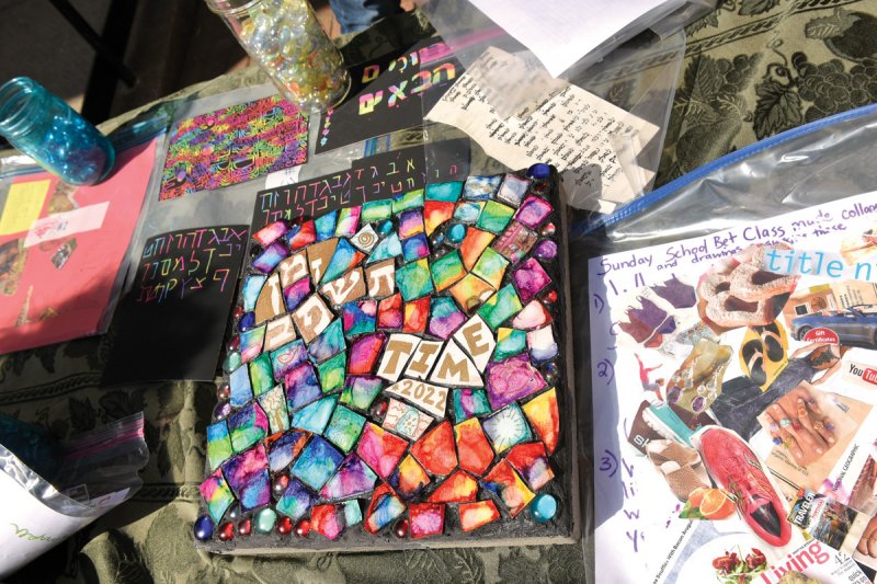 A community mosaic stepping stone just before being installed as a marker for the site of the capsule on Oct. 2, 2022. Photo by Super Source Media Studios.  