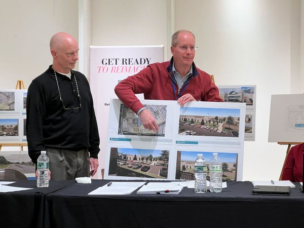 Paramount Development principal Tom Settle (left) and Wilton Mall general manager Mike Shaffer (right) discuss plans to construct 296 apartments and 88 townhomes on the property of the Wilton Mall on Tuesday. Dylan McGlynn photo.