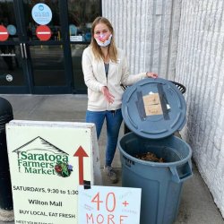 Composting at the Saratoga Farmers Market. Photo by Madison Jackson.