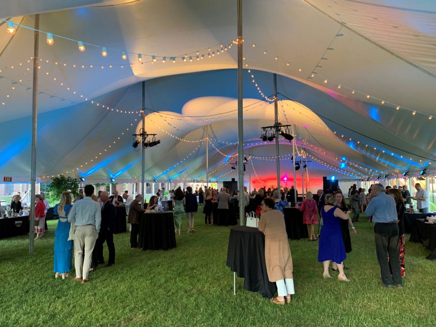 Scene from SPACtacular, the Saratoga Performing Arts Center’s summer kickoff fundraiser: guests begin to fill up the party tent; fireworks over the SPAC grounds; DJs Eric and Dillon led a late-night dance party on the amphitheater stage. Photo by Jonathon Norcross. 