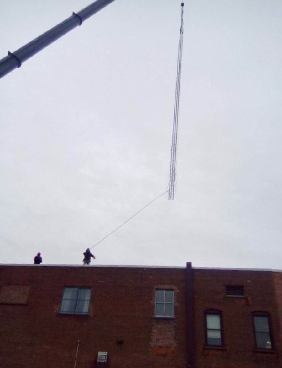 Radio tower being removed on Putnam Street earlier this month. Photo provided. 