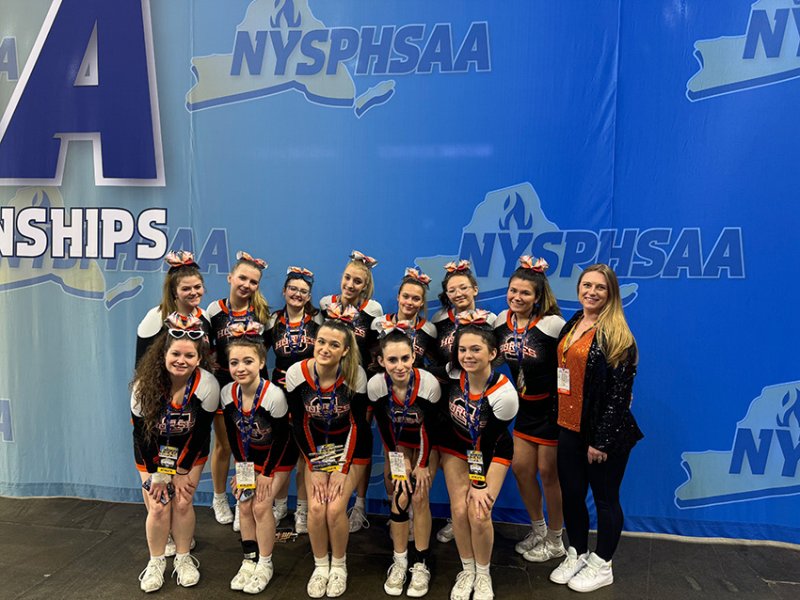The Schuylerville High School varsity cheerleading team poses at the state championship competition in Binghamton earlier this month. Photo via Schuylerville Central School District. 