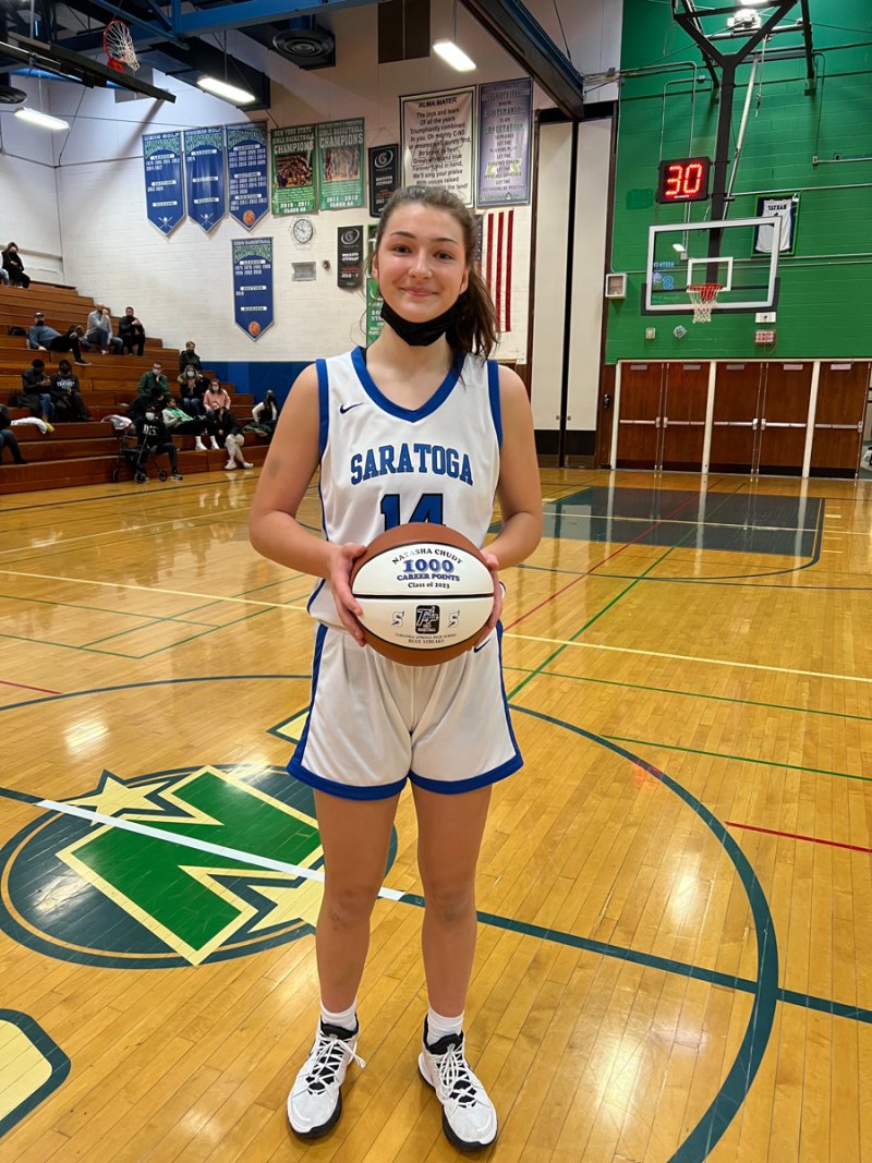 Saratoga Springs senior Natasha Chudy is pictured after scoring her  1,000th career varsity point during a game against  Section III’s Bishop Kearney last season (Photo provided by Robin Chudy).