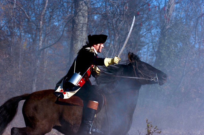 Benedict Arnold charges into action at the Battle of Saratoga in this scene from the film  &quot;Benedict Arnold : Hero Betrayed.&quot; Photo provided. 